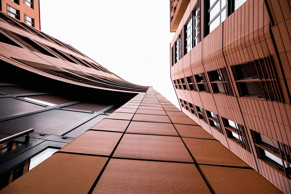 office building low-angle photography of brow building city